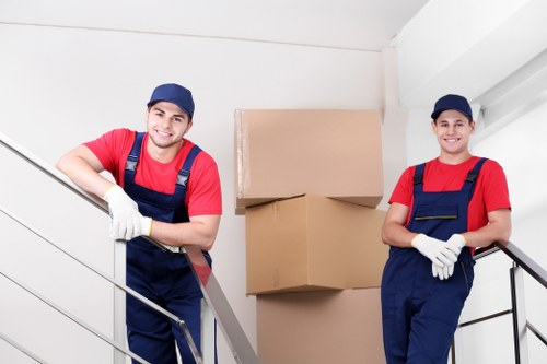 Professional movers handling furniture during a local home move