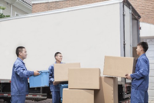 Removal van and moving team preparing for a house move in Churchend