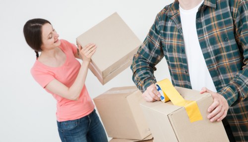 Commercial movers handling office furniture and boxes