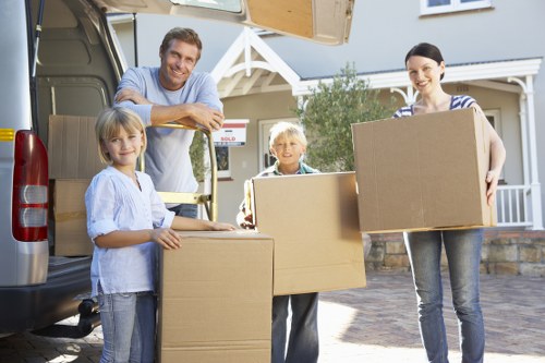 Loading furniture into a van for a Churchend removal job