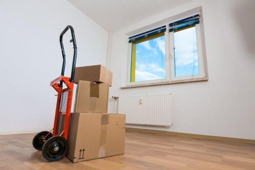 Packed office boxes and furniture ready for transport in Churchend