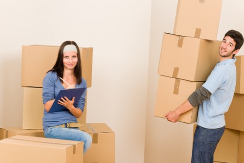 Loading boxes and furniture into a removal van in Churchend