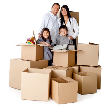 Packed moving boxes and furniture ready for removal in Churchend